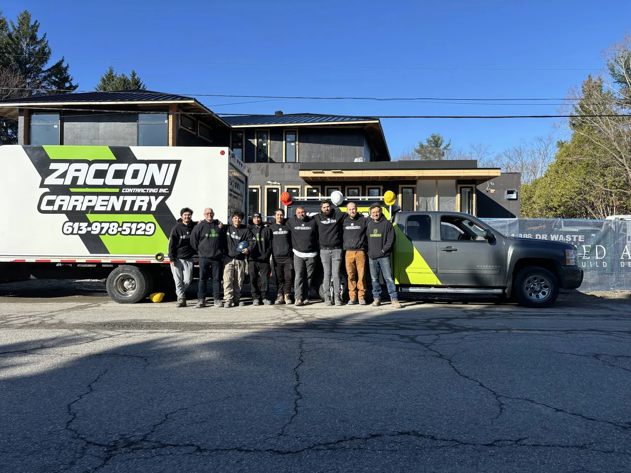 The Zacconi carpentry team beside their branded work truck and trailer